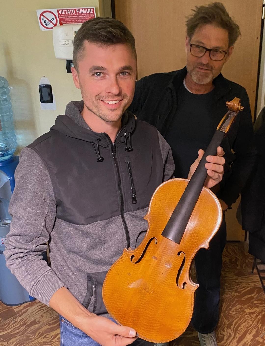 Doug Coghill holding a Guadagnini viola