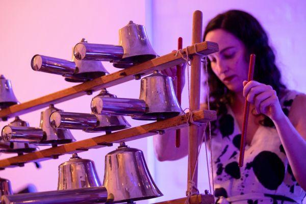 Kaylie Melville playing a set of tuned bells