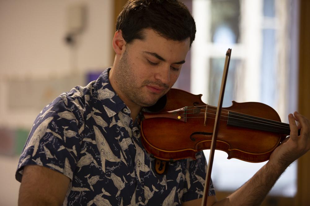 ANAM violinist Adrian Biemmi performing Felicity Wilcox's To The Sea in one of the pop up performances around the Abbotsford Convent